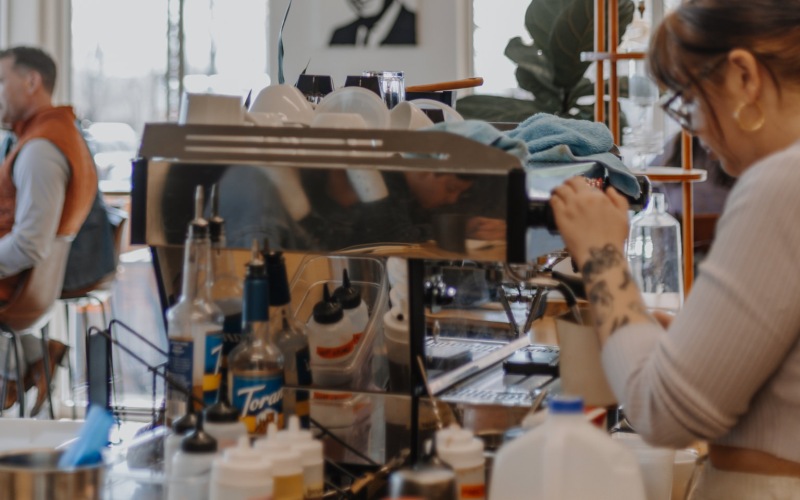 a barista making coffee