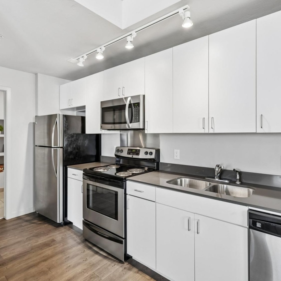 a kitchen with white cabinets