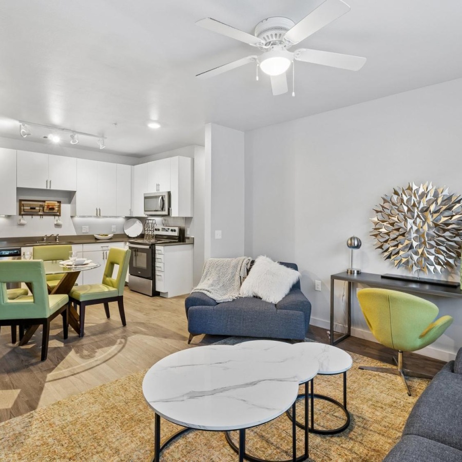 a living room with a table and chairs