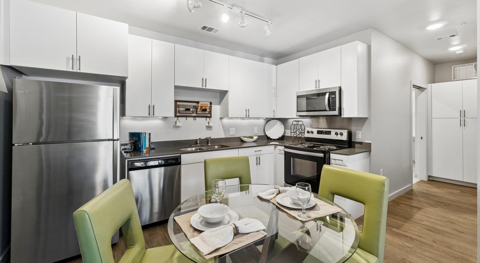a kitchen with white cabinets