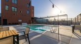 a swimming pool with a table and chairs