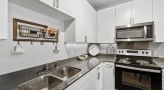 a kitchen with white cabinets